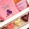 Gavekurv med rosé, chokolade, te og vingummi