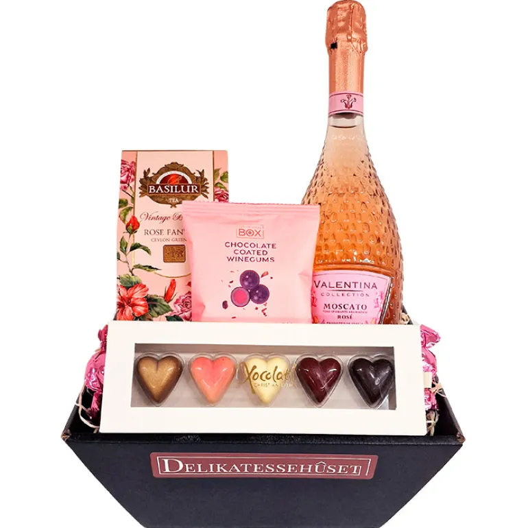 Gavekurv med rosé, chokolade, te og vingummi