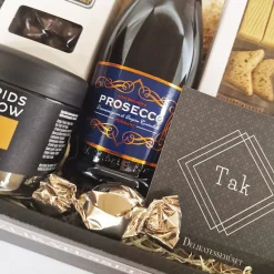 Gavekurv - send en 'tak' med Prosecco-bobler, chokolade og lakrids