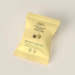 Vingummi med hvid chokolade, passionsfrugt og mango. Flowpack - Box the original